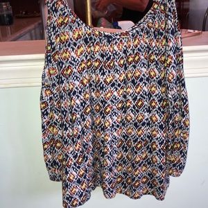 blue, white, orange, and yellow shirt